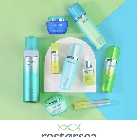 Several Restorsea skincare products laying on a white semi-circular stone above a green and blue color-blocked background, with the Restorsea logo at the bottom.