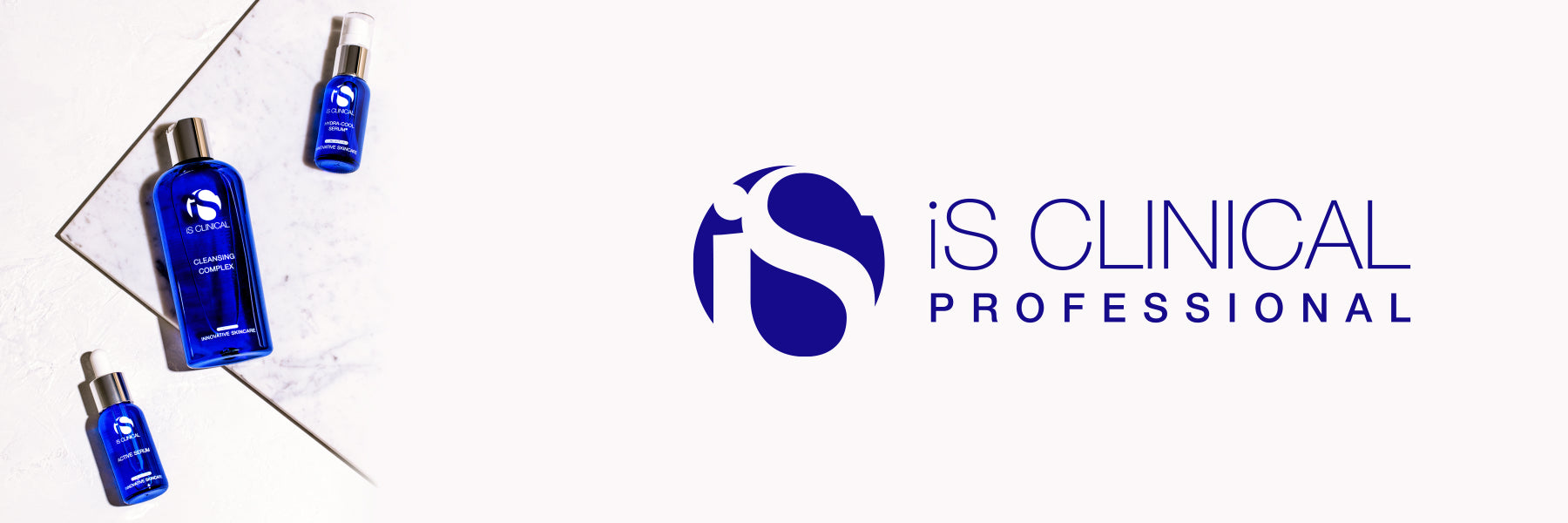 Three iS Clinical products lie on a white marble countertop, with the iS Clinical logo superimposed nearby