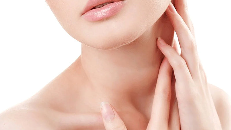 Closeup on a woman touching her neck with her hands