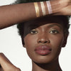 jane iredale Glow Time Highlighter Stick Arm Swatches Dark Complexion